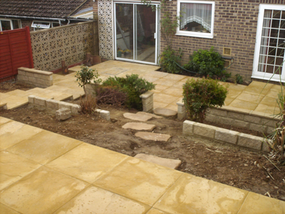 Tiered Garden, granite walls with coping Indian sandstone patio and steps 004.jpg